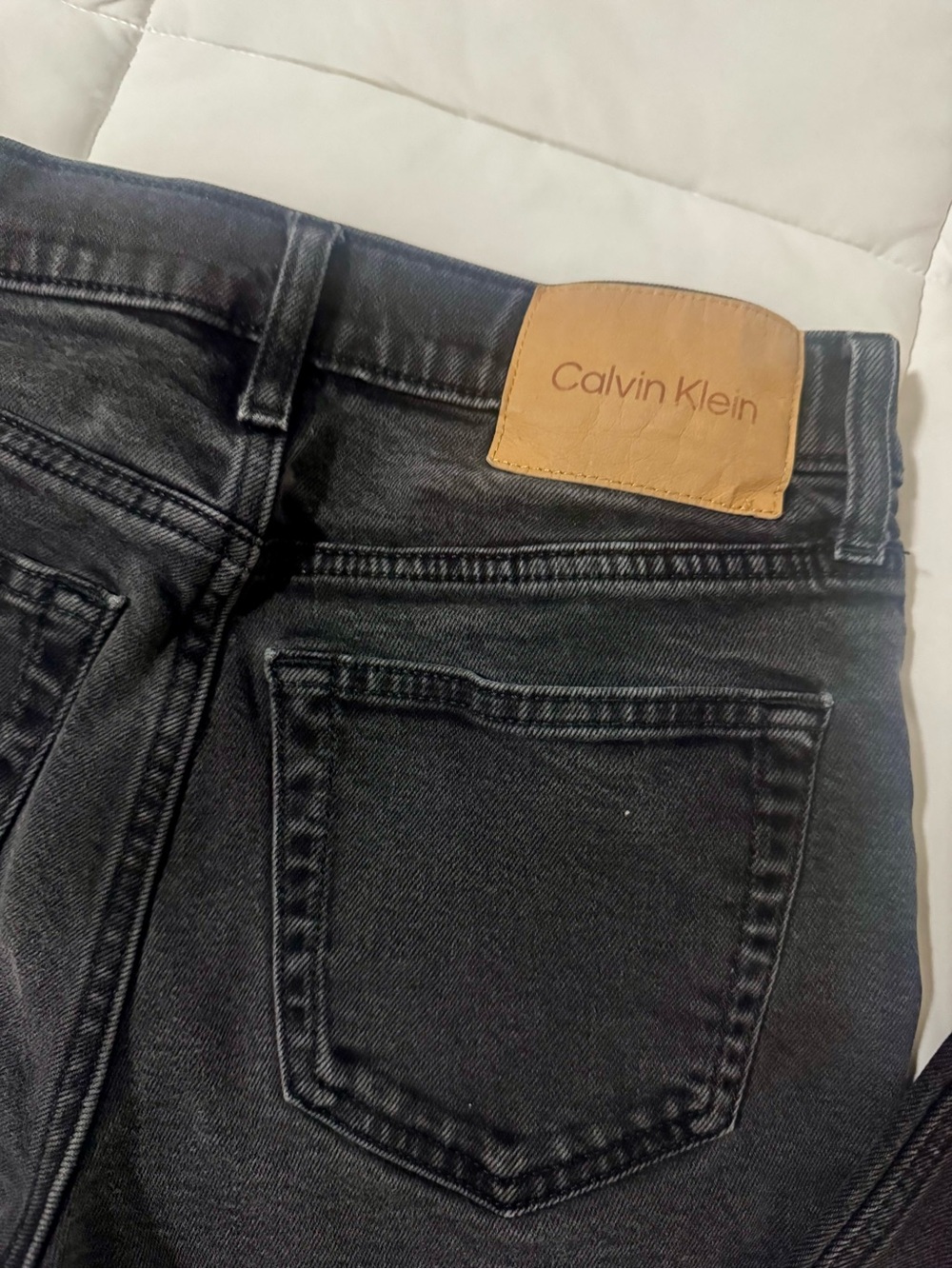 Calvin Klein Men’s Slim/Straight Black Denim Jeans with Tan Logo Patch Size W27